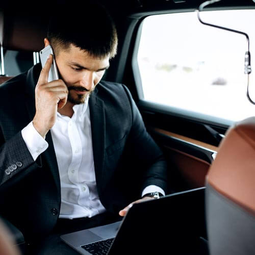 Car chauffeur Milan: man working during a tranfer
