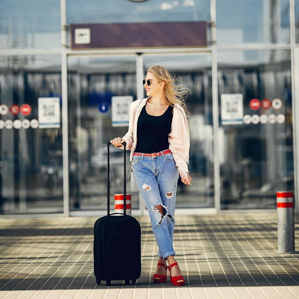 Chauffeur Car Hire Milan: beautiful girl standing airport