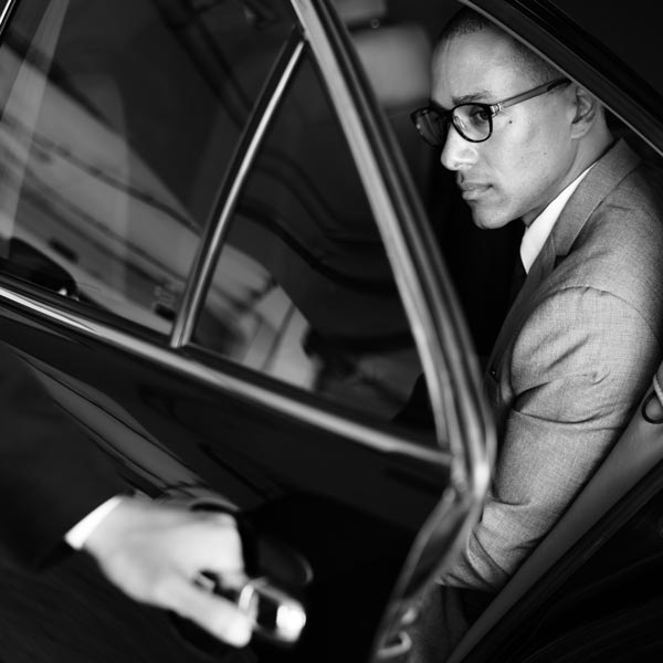 Hire Car with Driver Milan: Hand open car door businessman